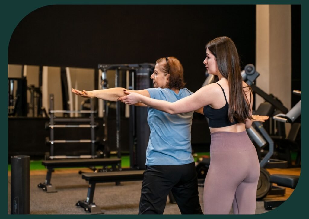 Senior woman working out with her yoga instructor.