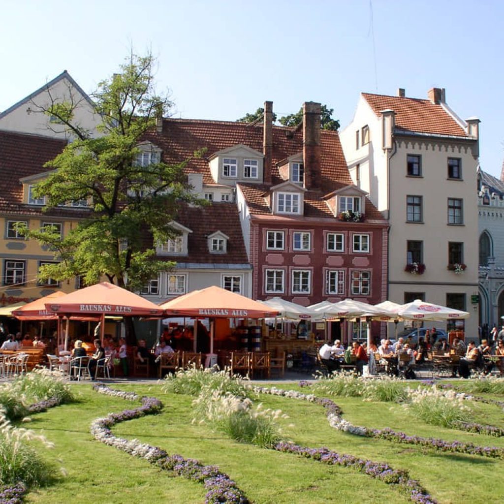 Tourists enjoying the local flavors of Riga, Latvia.