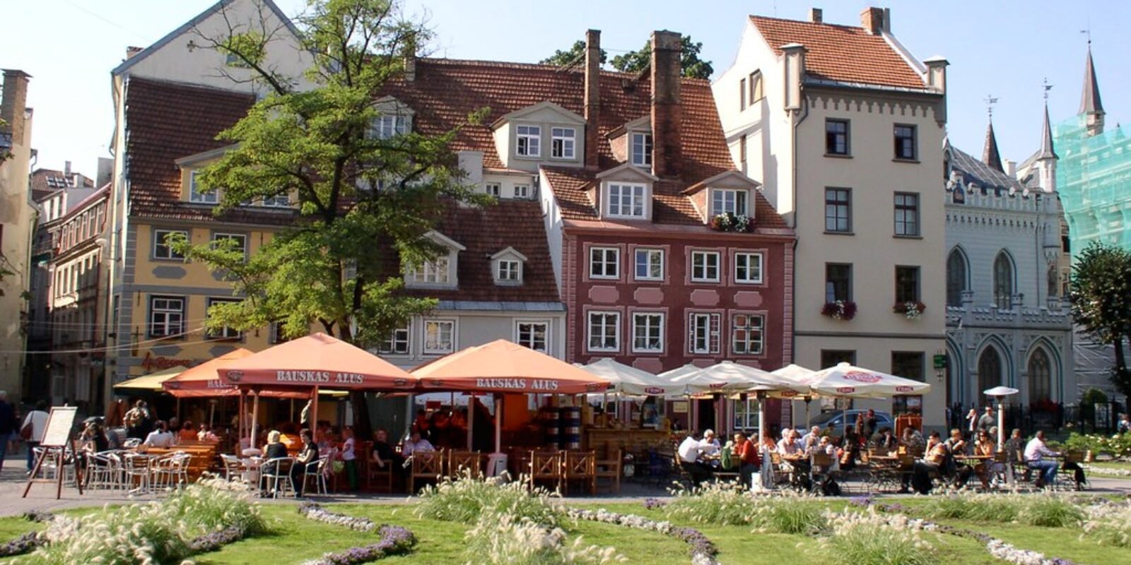 Tourists enjoying the local flavors of Riga, Latvia.