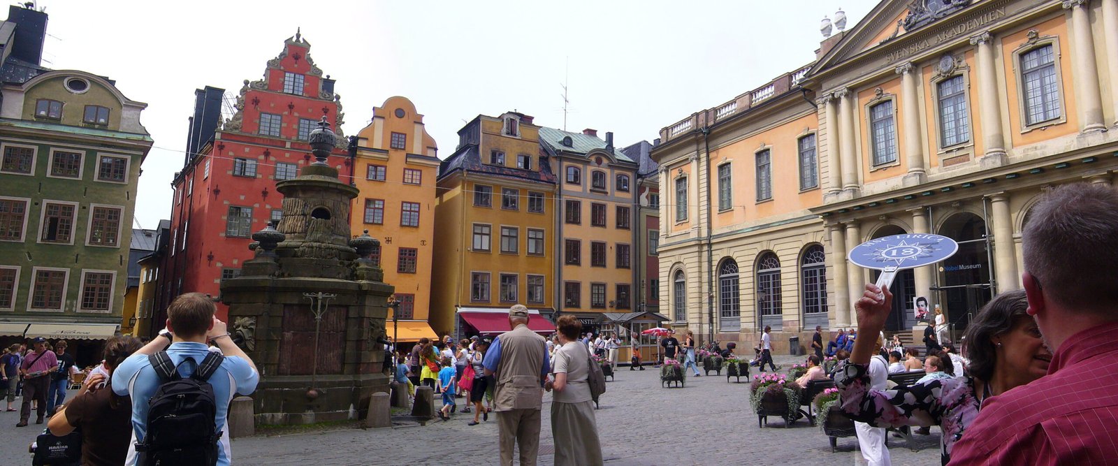 An image of tourists visiting senior Sweden travel spots.