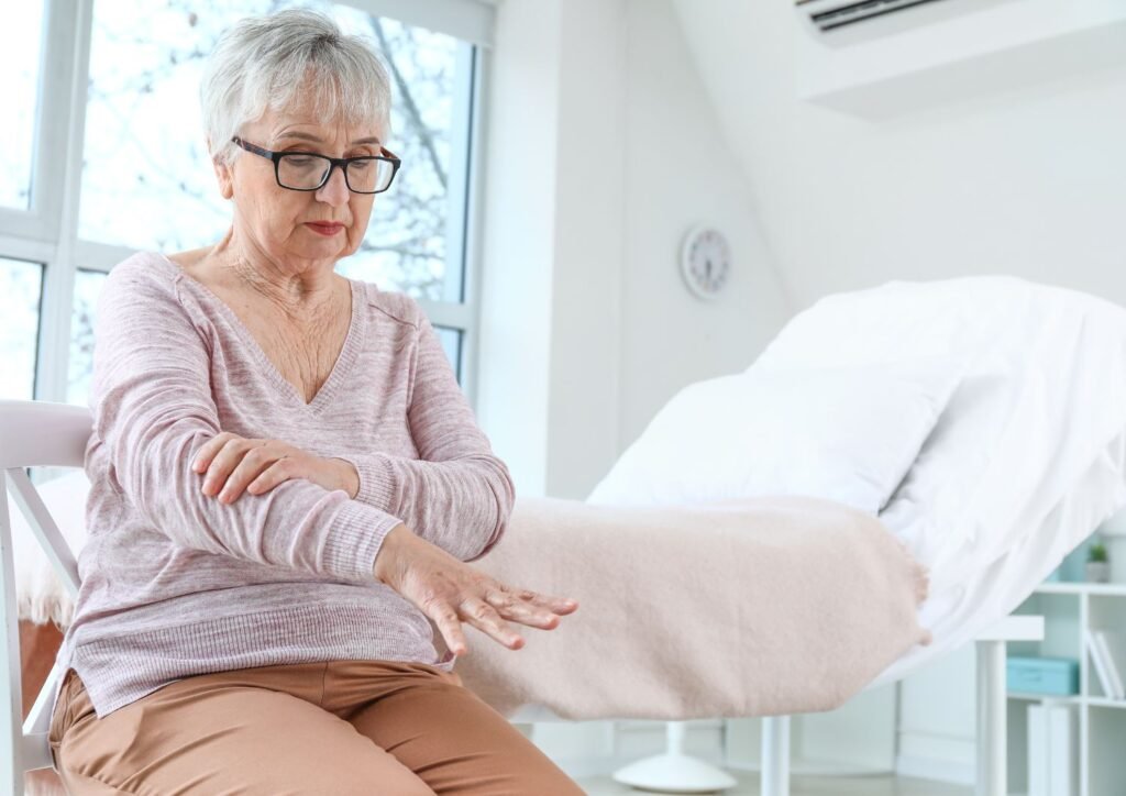 A sign of Parkinson's disease on a female senior.