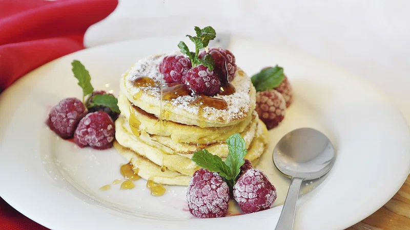 An image of Biezpiena Plācenīši with berry garnishing. 