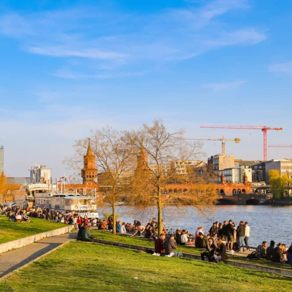 An image of tourists visiting the East Side Gallery Park for an article about "senior trips to Berlin."