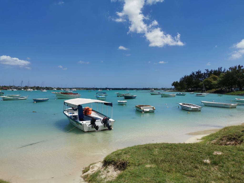 An image of boats on the Grand Baie waters.