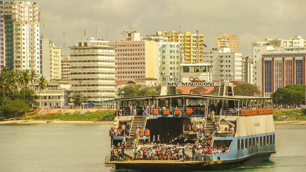 An image of tourists riding the Kigamboni ferry for the topic about senior vacation to Dar es Salaam.