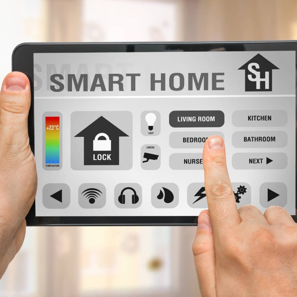 a person holding a tablet opening a home automation app