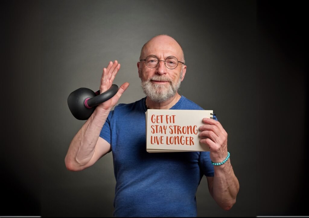 An image of a man holding a weight holding a sign with text