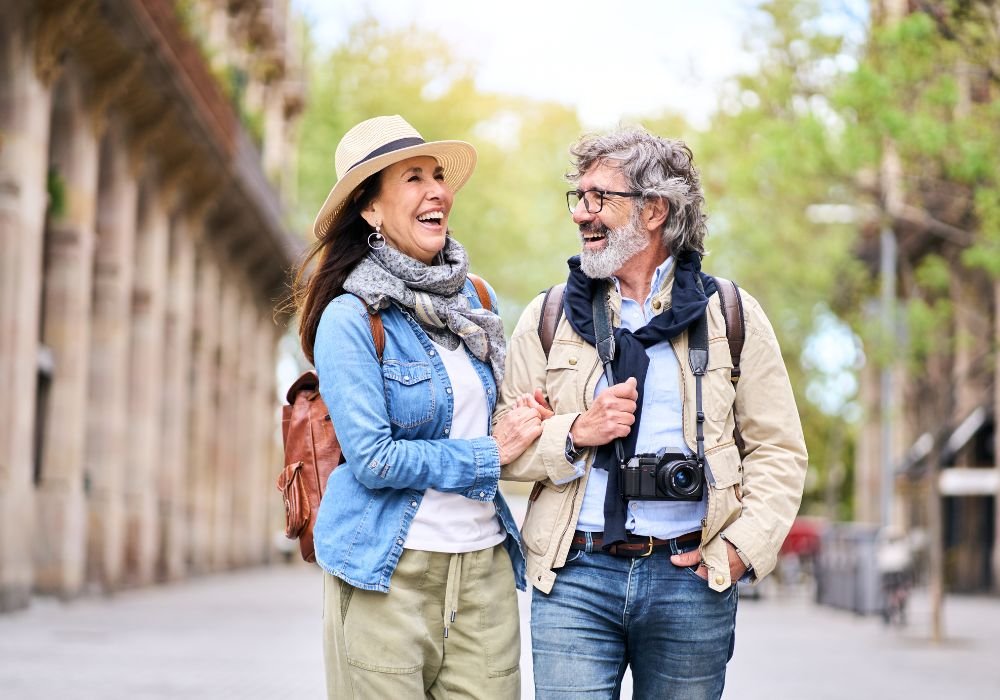 An image of a couple walking along a foreign street. 