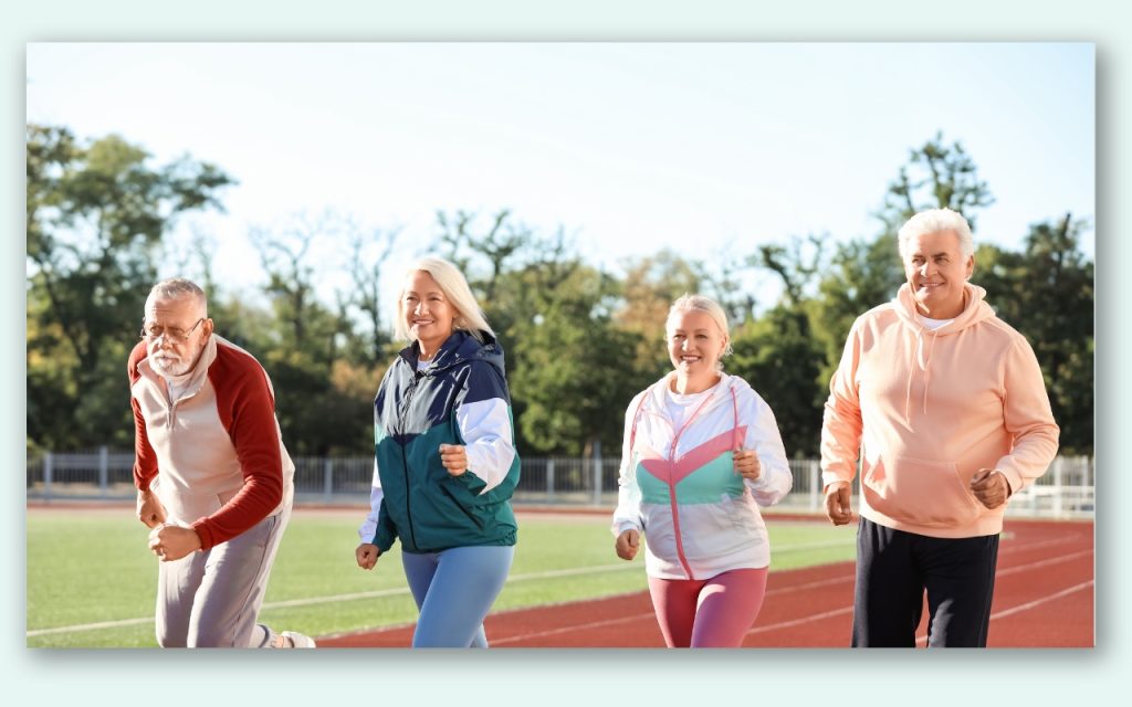 An image of seniors on a track field jogging